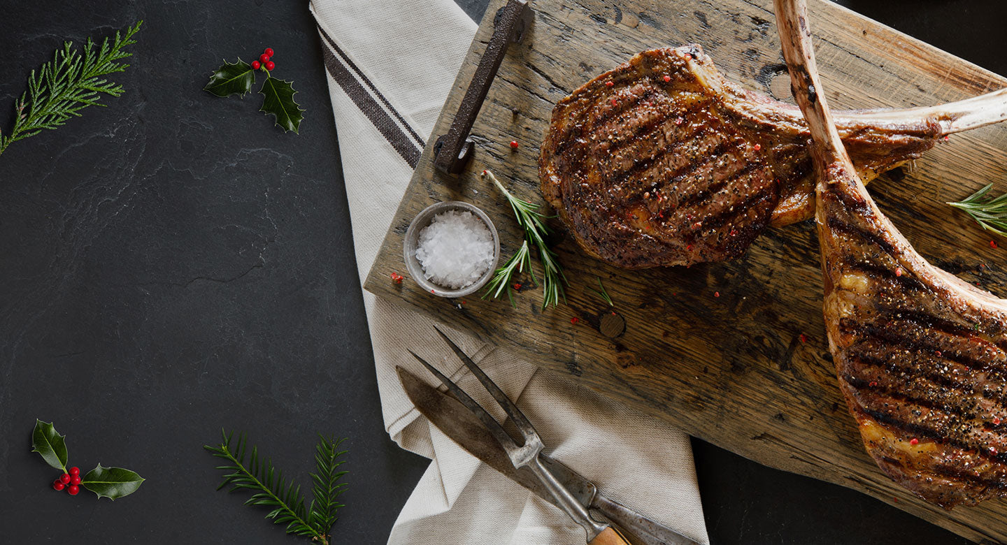 tomahawk steaks on a cutting board