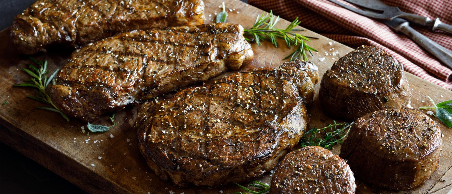 grilled steak cuts on cutting board